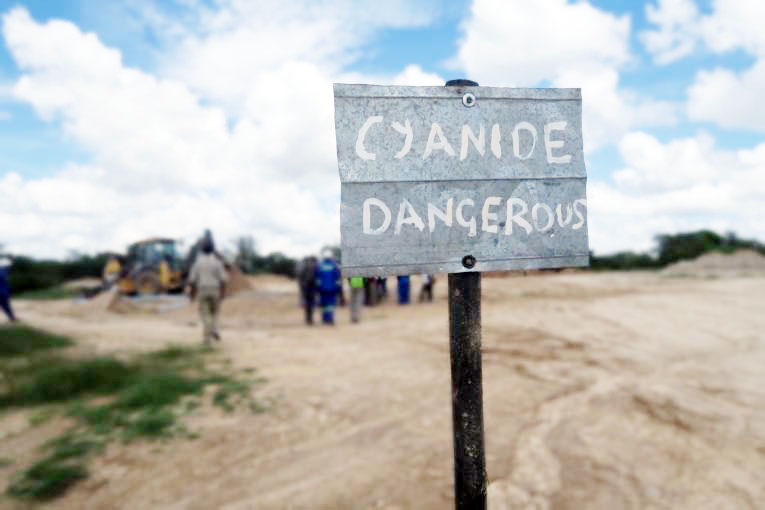 Contaminated river with gold mining pollution
